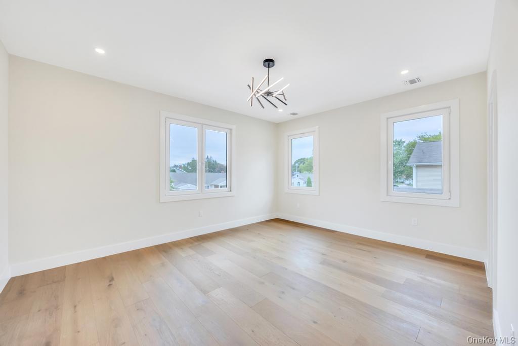 472 Farm Ranch Road East Bethpage, NY 11714 - Photo 23 of 40 a view of an empty room with a window