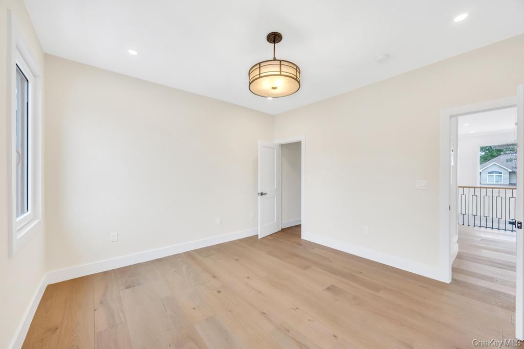 472 Farm Ranch Road East Bethpage, NY 11714 - Photo 27 of 40 Empty room with light wood-type flooring and recessed lighting