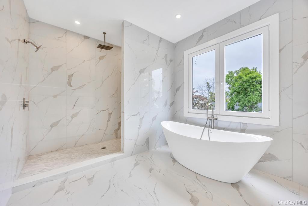 472 Farm Ranch Road East Bethpage, NY 11714 - Photo 34 of 40 a white bath tub sitting in a bathroom