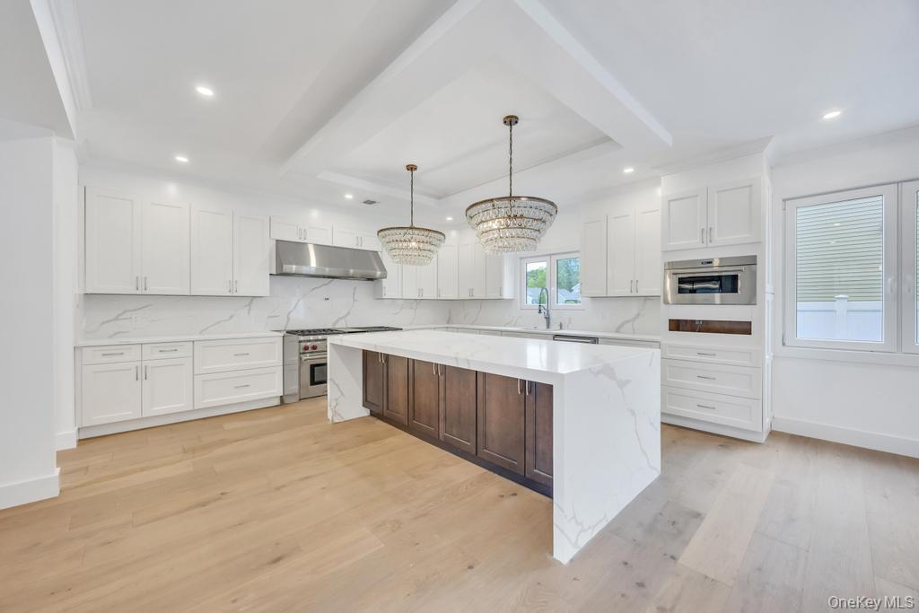 472 Farm Ranch Road East Bethpage, NY 11714 - Photo 7 of 40 a large kitchen with stainless steel appliances cabinets a sink and a counter top space