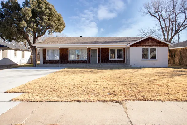 a house with trees in the background