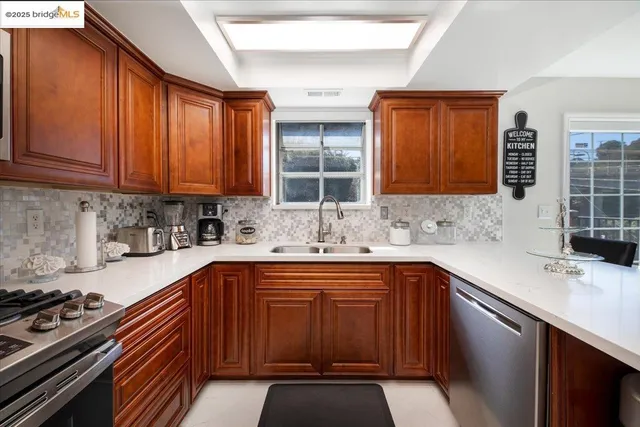 a kitchen with a sink stove and cabinets