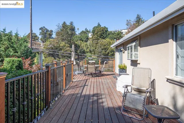 a view of balcony with furniture and wooden deck
