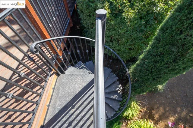 a view of balcony with wooden floor and fence