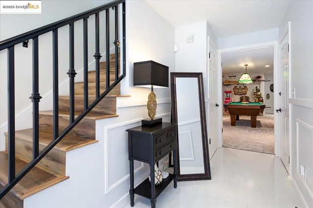 a view of stairs and living room