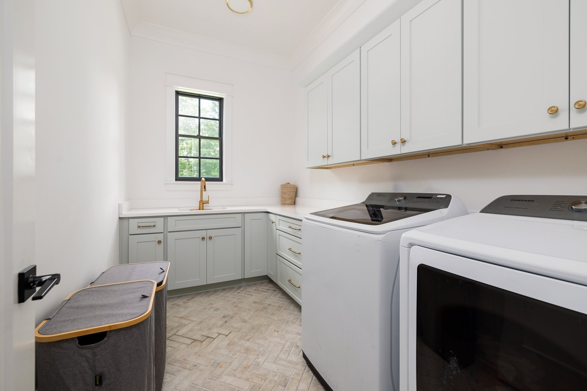5024 Cobbler Ridge Road Franklin, TN 37064 - Photo 41 of 58 a utility room with cabinets washer and dryer