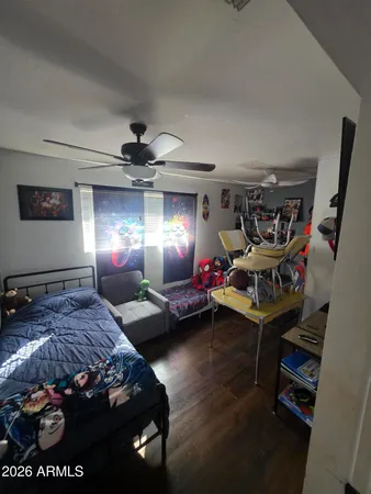 a bedroom with furniture and a chandelier