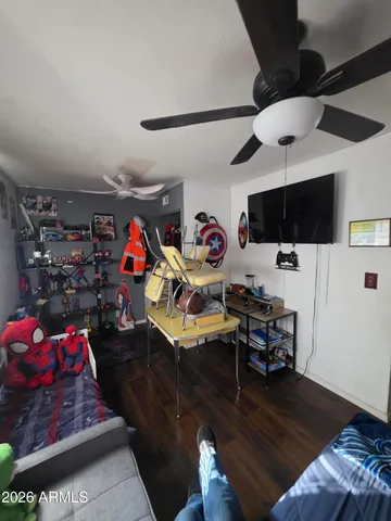 a living room with lots of furniture and a wooden floor