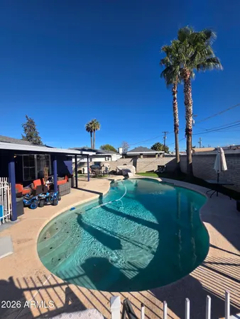 a view of a backyard with furniture
