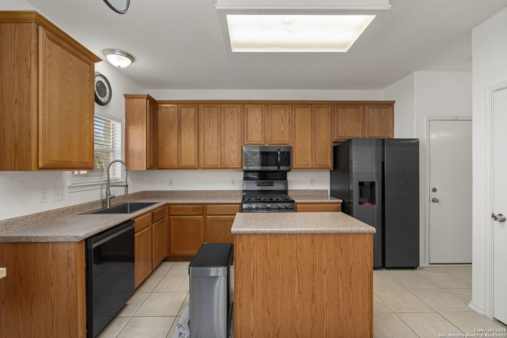 8947 Burnt Path Helotes, TX 78023 - Photo 11 of 34 a kitchen with stainless steel appliances granite countertop a refrigerator sink and stove