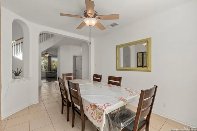 a dining room with furniture and window