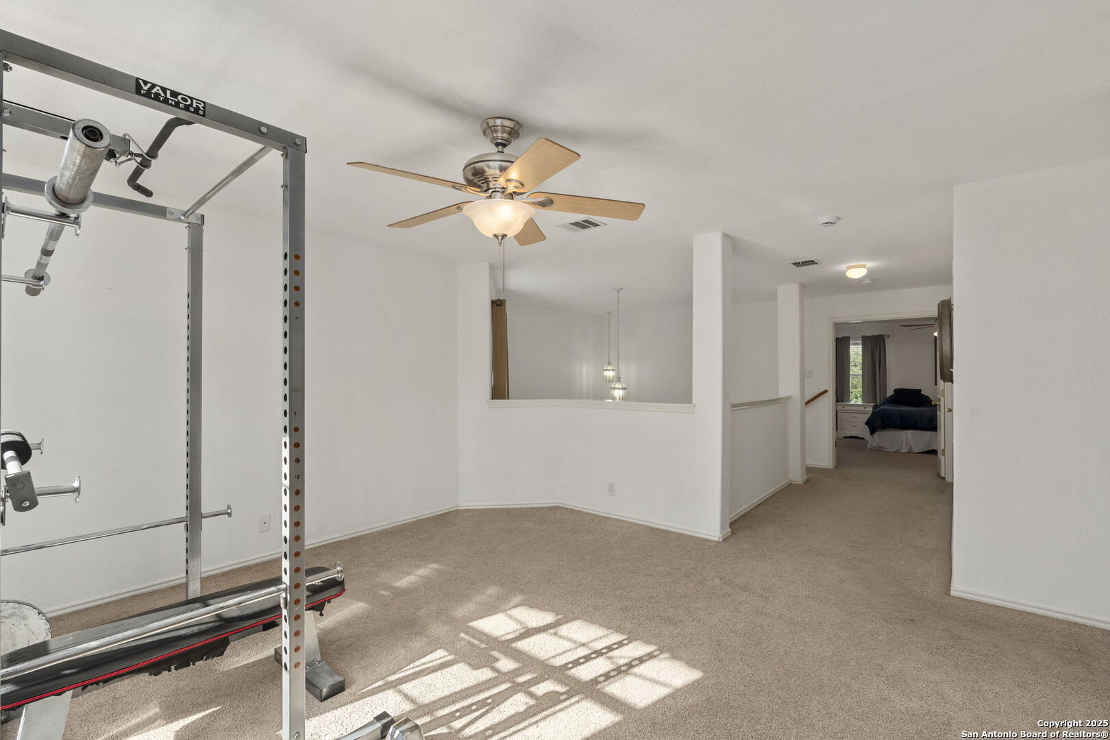 8947 Burnt Path Helotes, TX 78023 - Photo 25 of 34 a view of a room with a ceiling fan and window