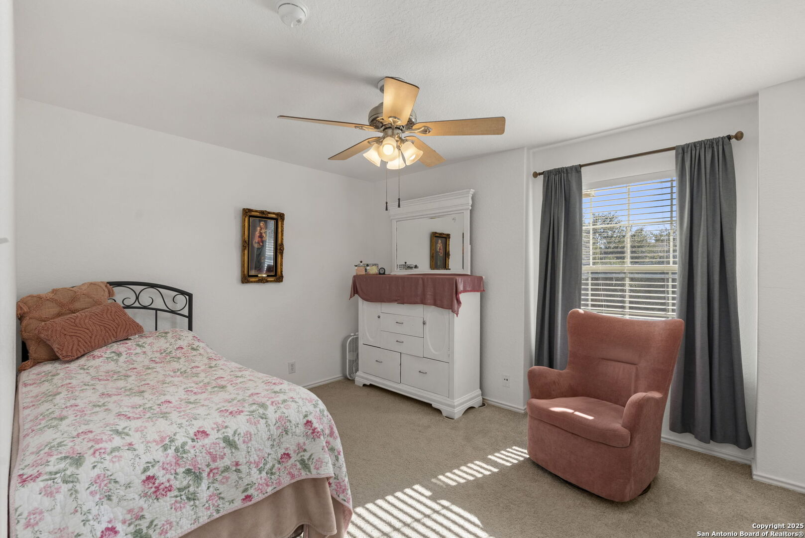 8947 Burnt Path Helotes, TX 78023 - Photo 29 of 34 a bedroom with a bed and a couch