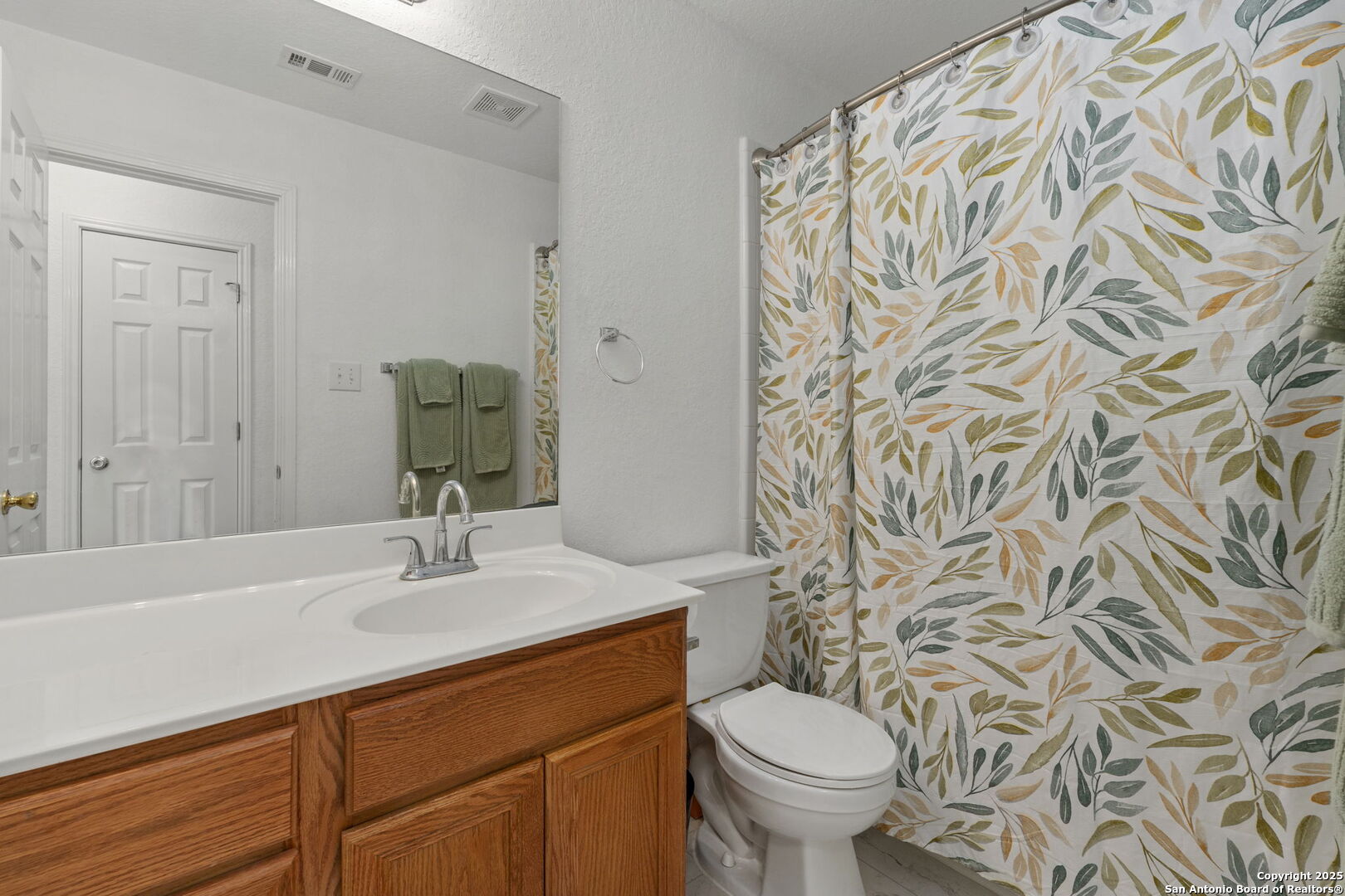 8947 Burnt Path Helotes, TX 78023 - Photo 30 of 34 a bathroom with a sink toilet and shower