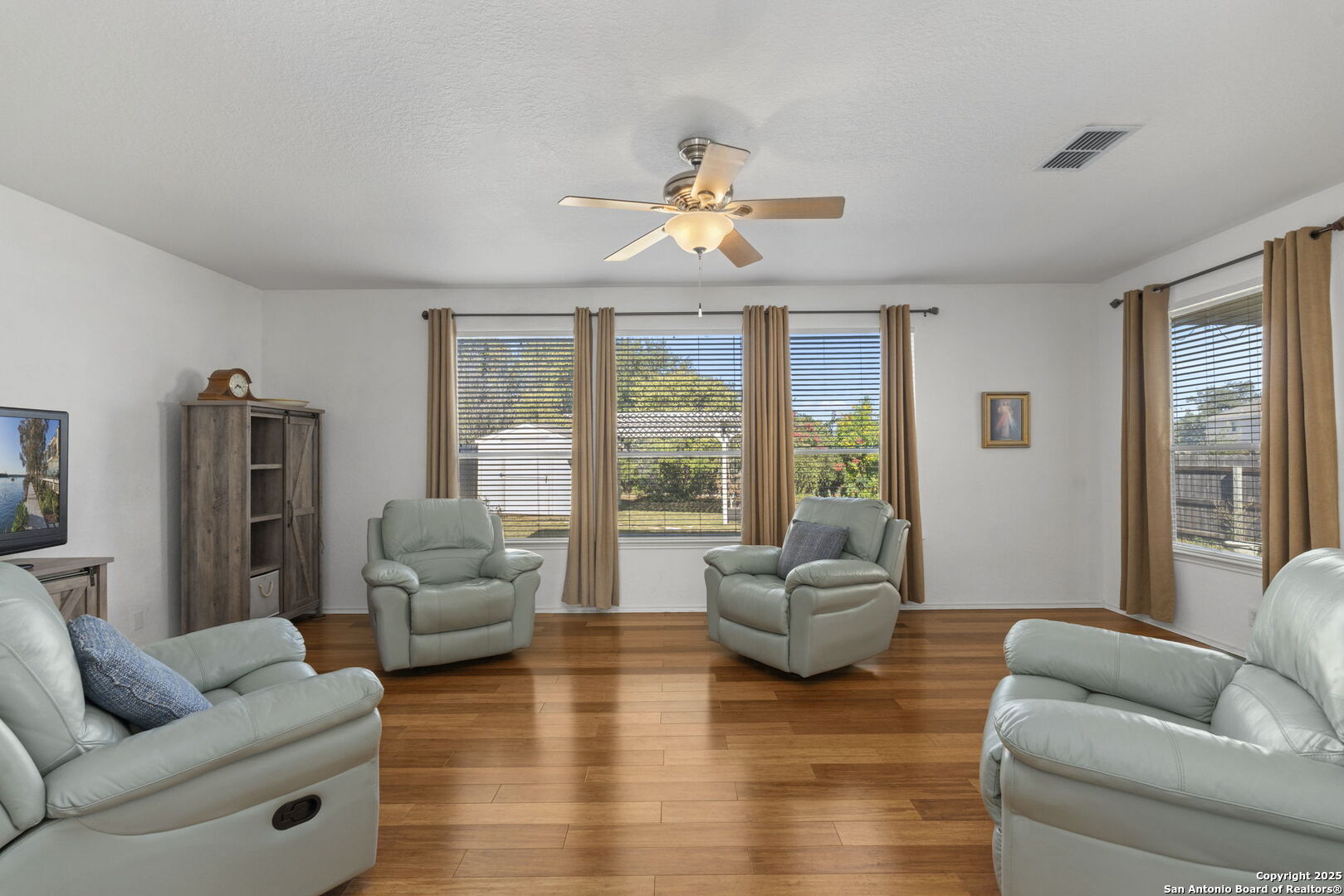 8947 Burnt Path Helotes, TX 78023 - Photo 5 of 34 a living room with furniture and a large window