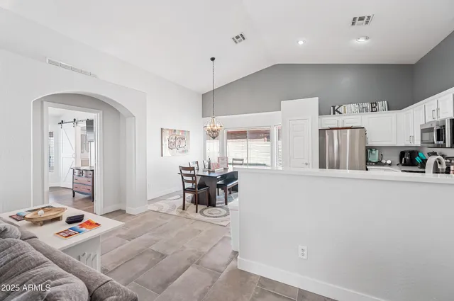 a view of a bedroom with wooden floor and cabinet