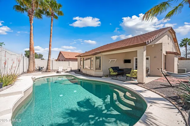 a house view with a sitting space and garden space