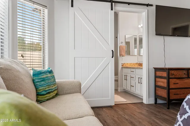 a bathroom with a granite countertop sink a shower and a bathtub