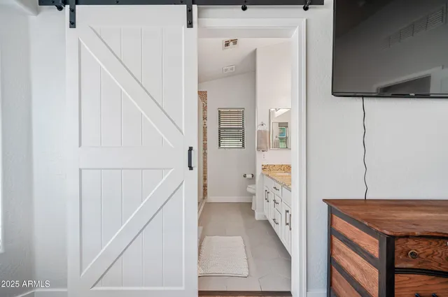 a view of a bathroom with a window and a shower