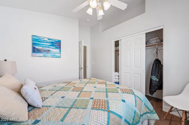 a bedroom with a bed and a window