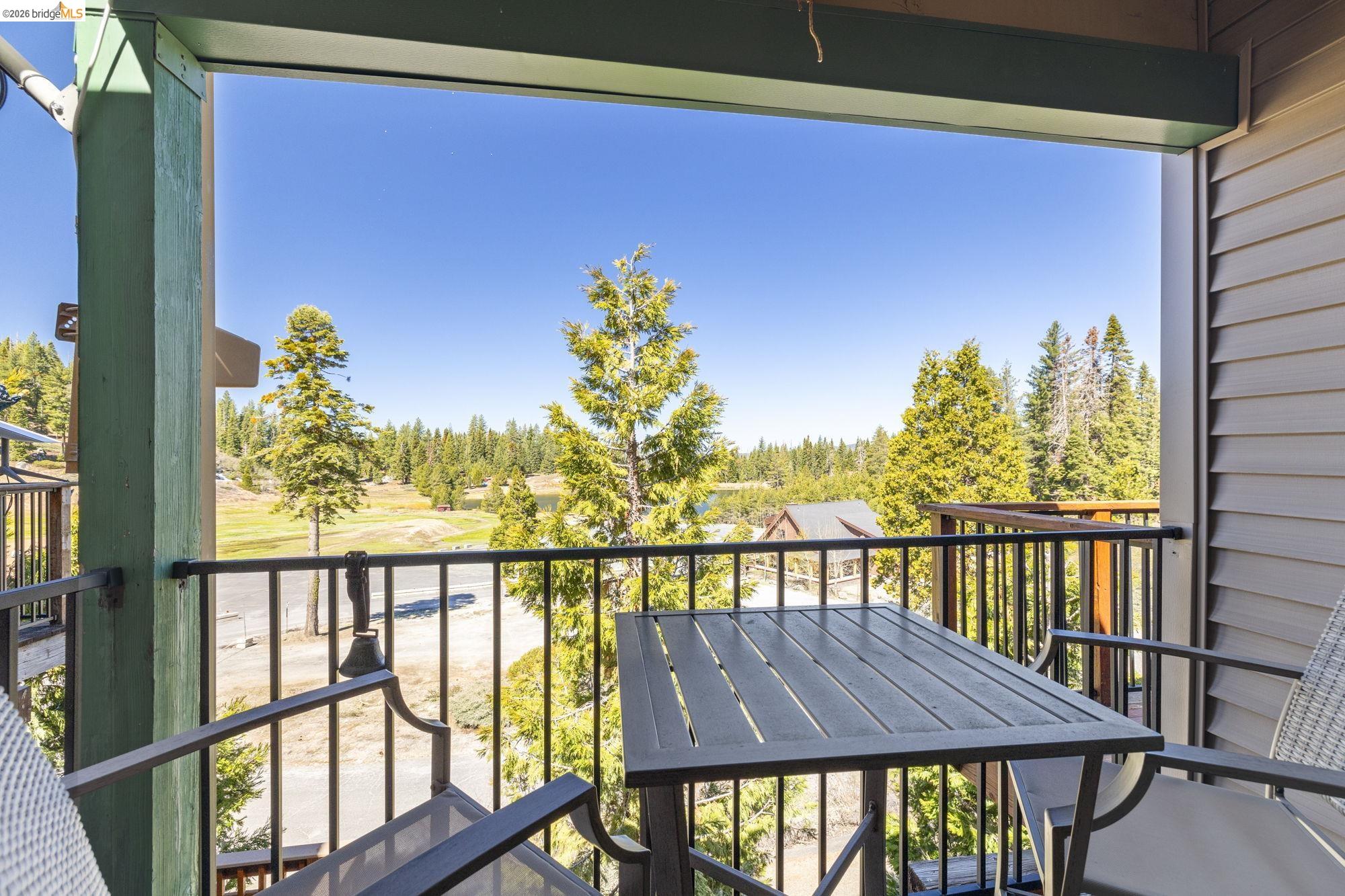 a view of a balcony with chair and table