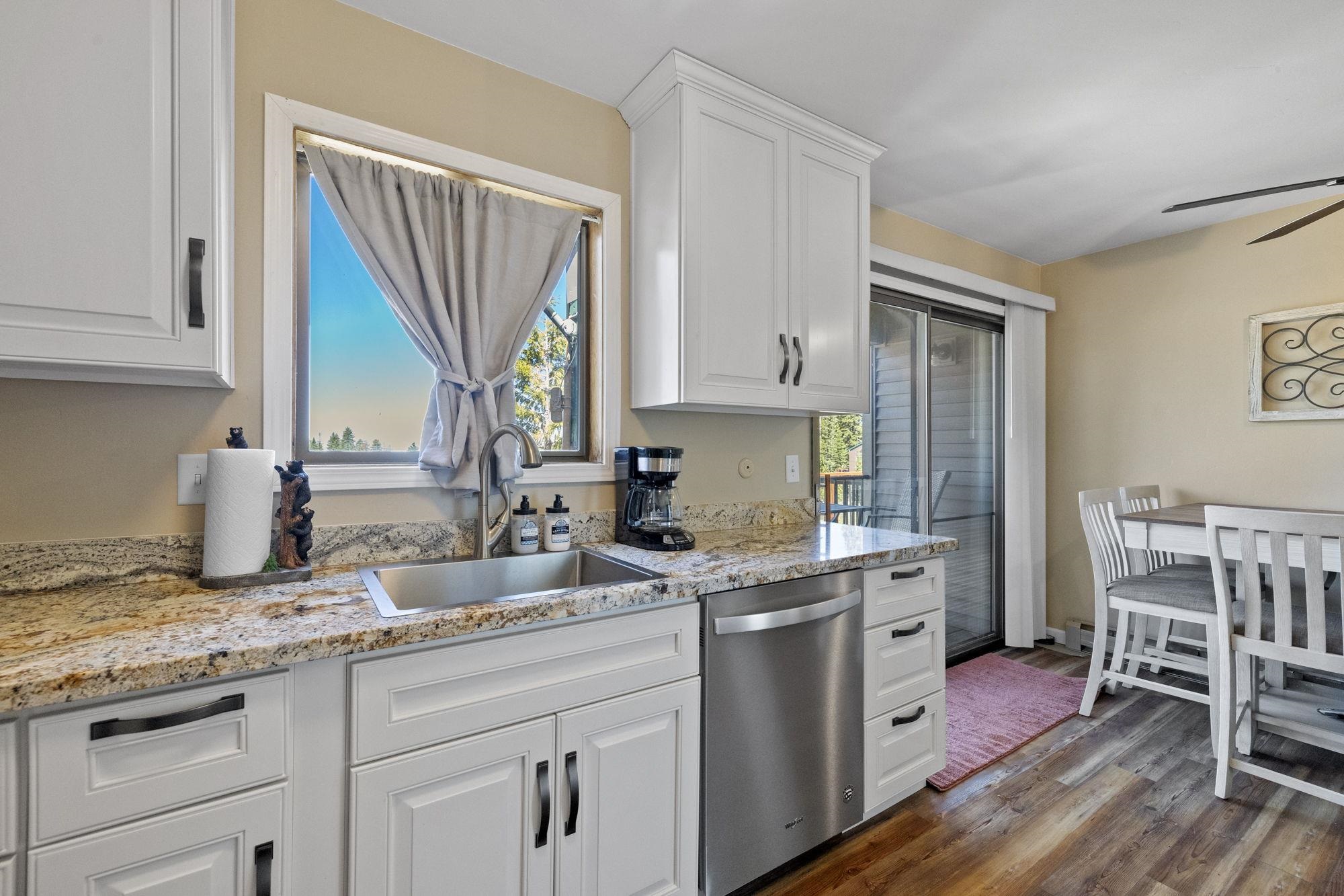 33757 Upper Leland Road, Unit B Pinecrest, CA 95364 - Photo 13 of 39 a kitchen with a sink cabinets and wooden floor