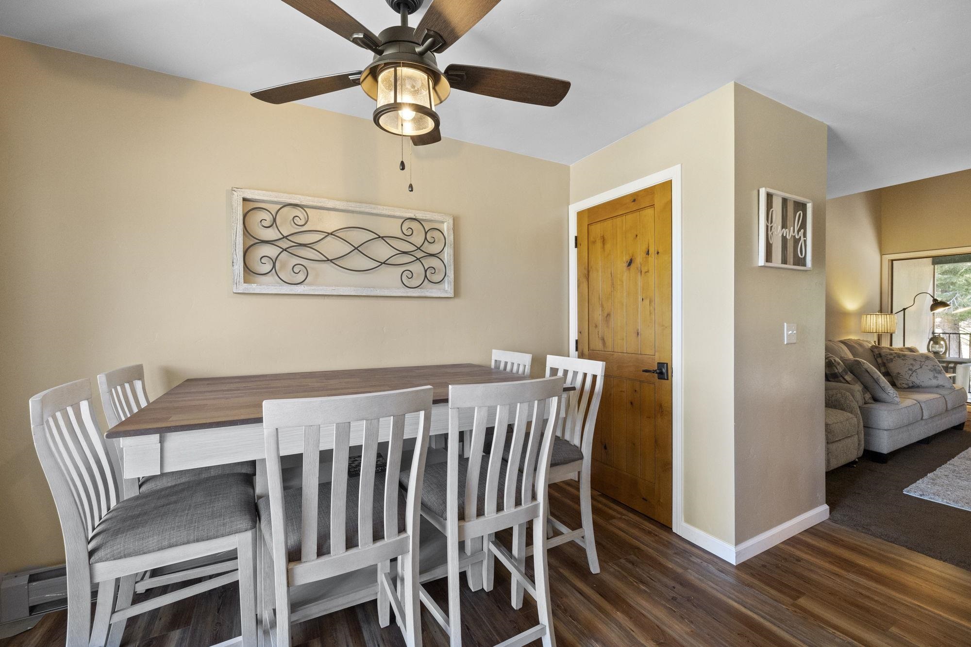 33757 Upper Leland Road, Unit B Pinecrest, CA 95364 - Photo 14 of 39 a view of a dining room with furniture and wooden floor