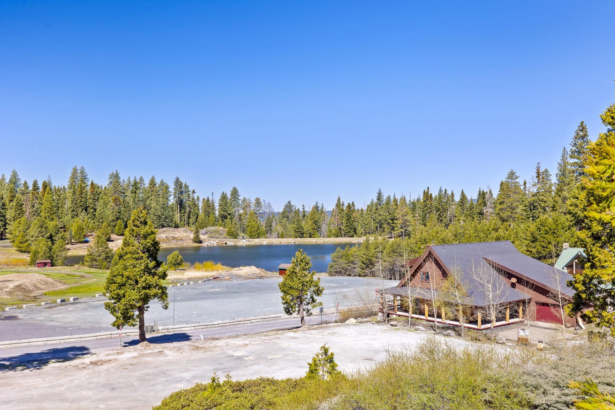 33757 Upper Leland Road, Unit B Pinecrest, CA 95364 - Photo 15 of 39 a view of a lake with a yard and large trees
