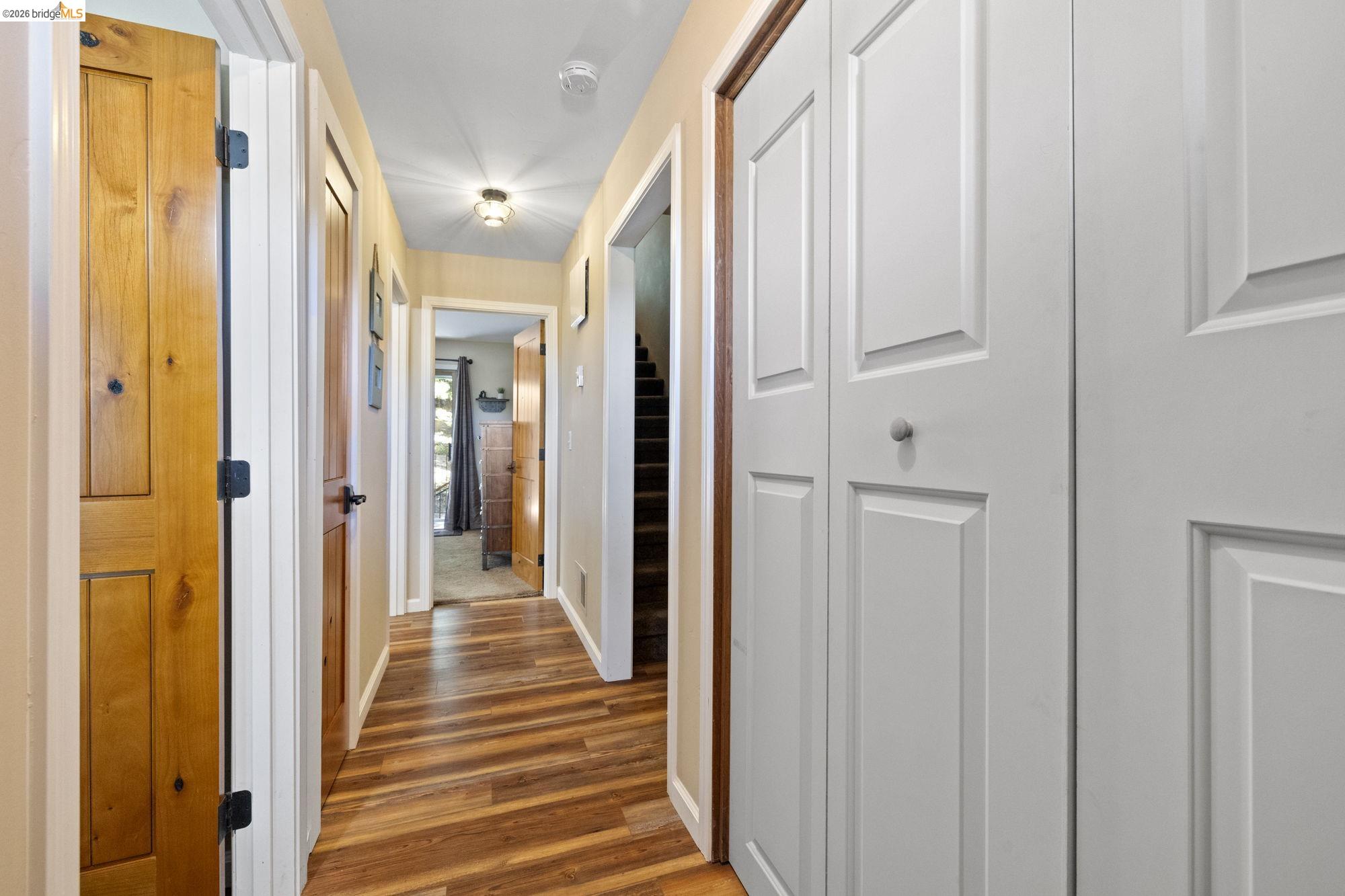 33757 Upper Leland Road, Unit B Pinecrest, CA 95364 - Photo 19 of 39 a view of a hallway with wooden floor and staircase