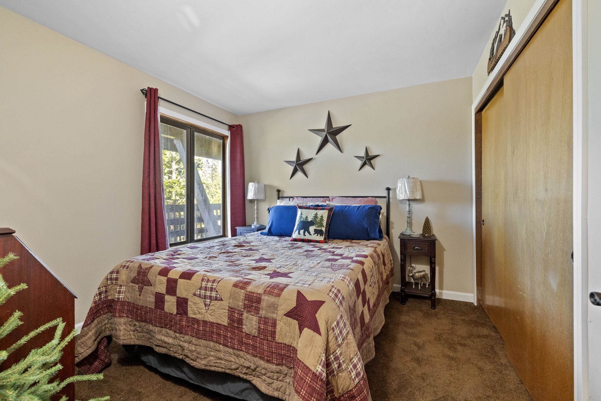 33757 Upper Leland Road, Unit B Pinecrest, CA 95364 - Photo 20 of 39 a bedroom with a bed and a window