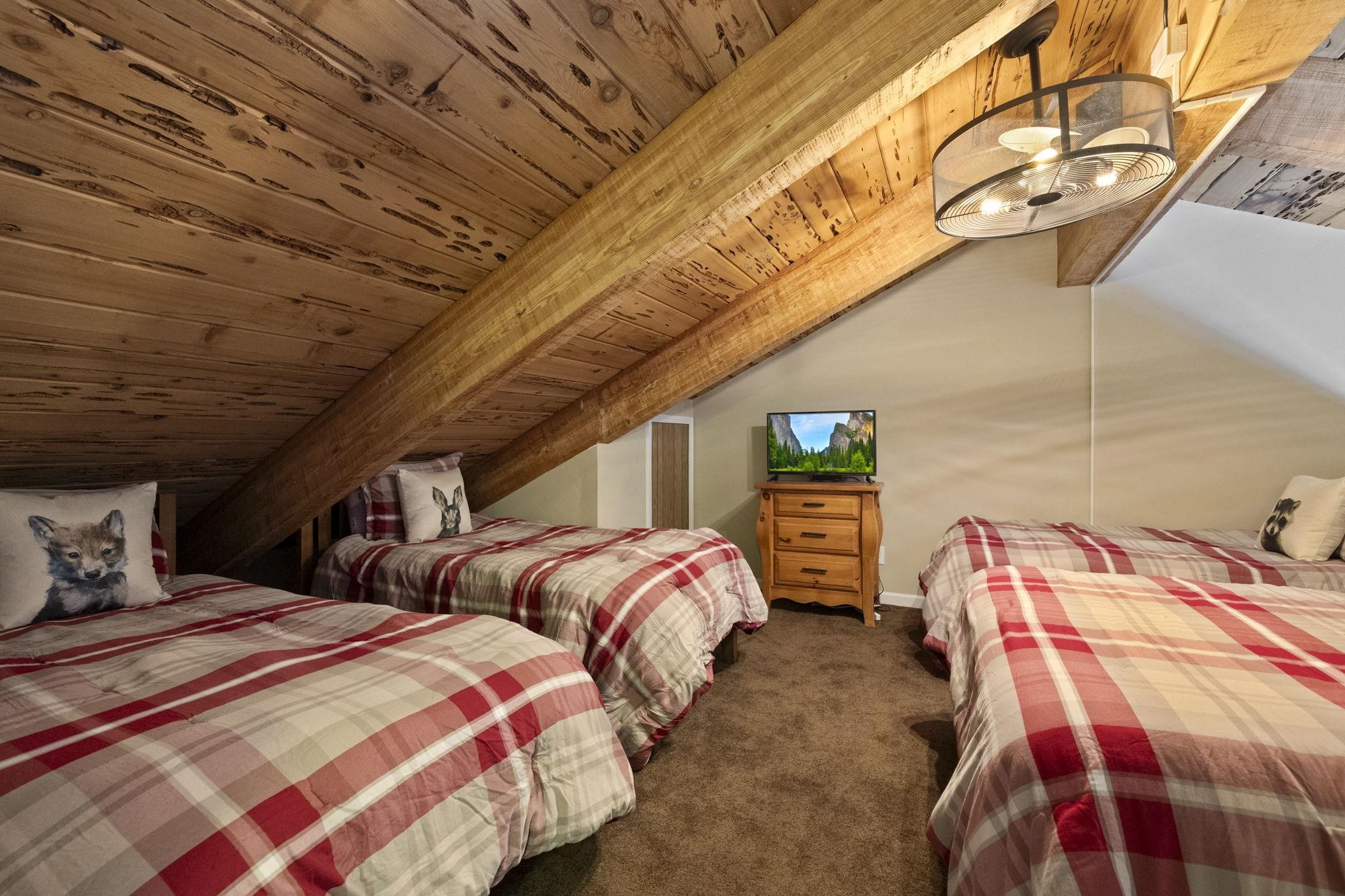 33757 Upper Leland Road, Unit B Pinecrest, CA 95364 - Photo 30 of 39 a bedroom with two beds and painted walls