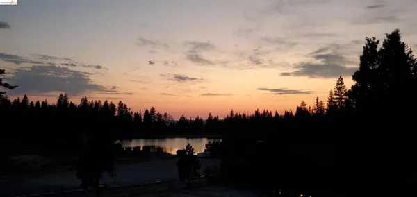 a view of a lake in middle of the house