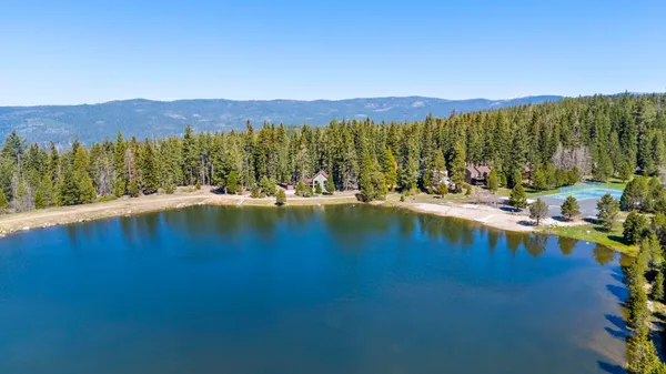 a view of an ocean with mountains in the background