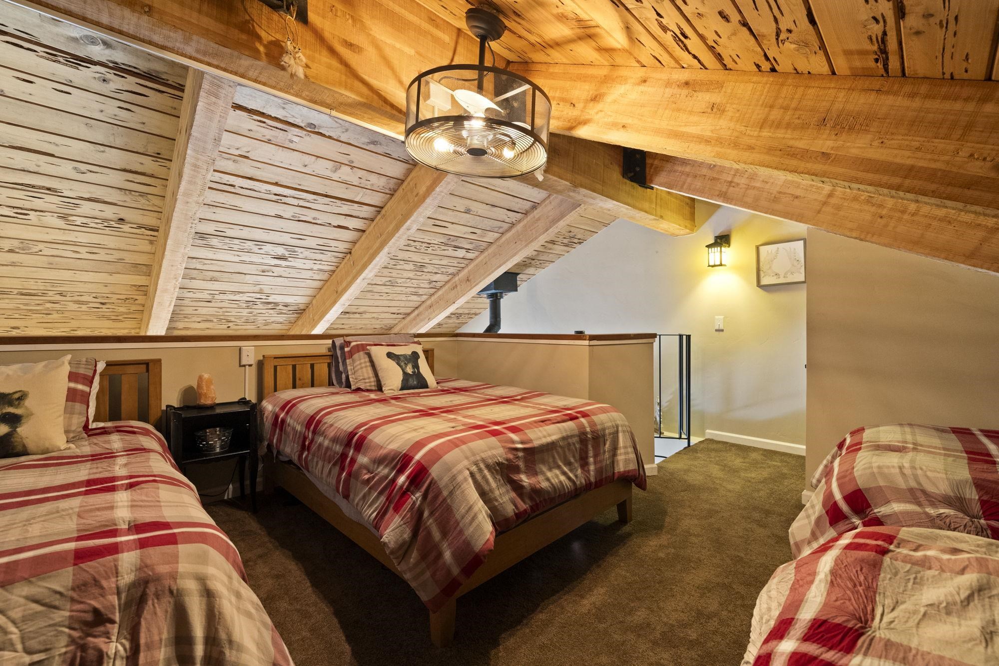 33757 Upper Leland Road, Unit B Pinecrest, CA 95364 - Photo 7 of 39 a bedroom with two beds and a night stand