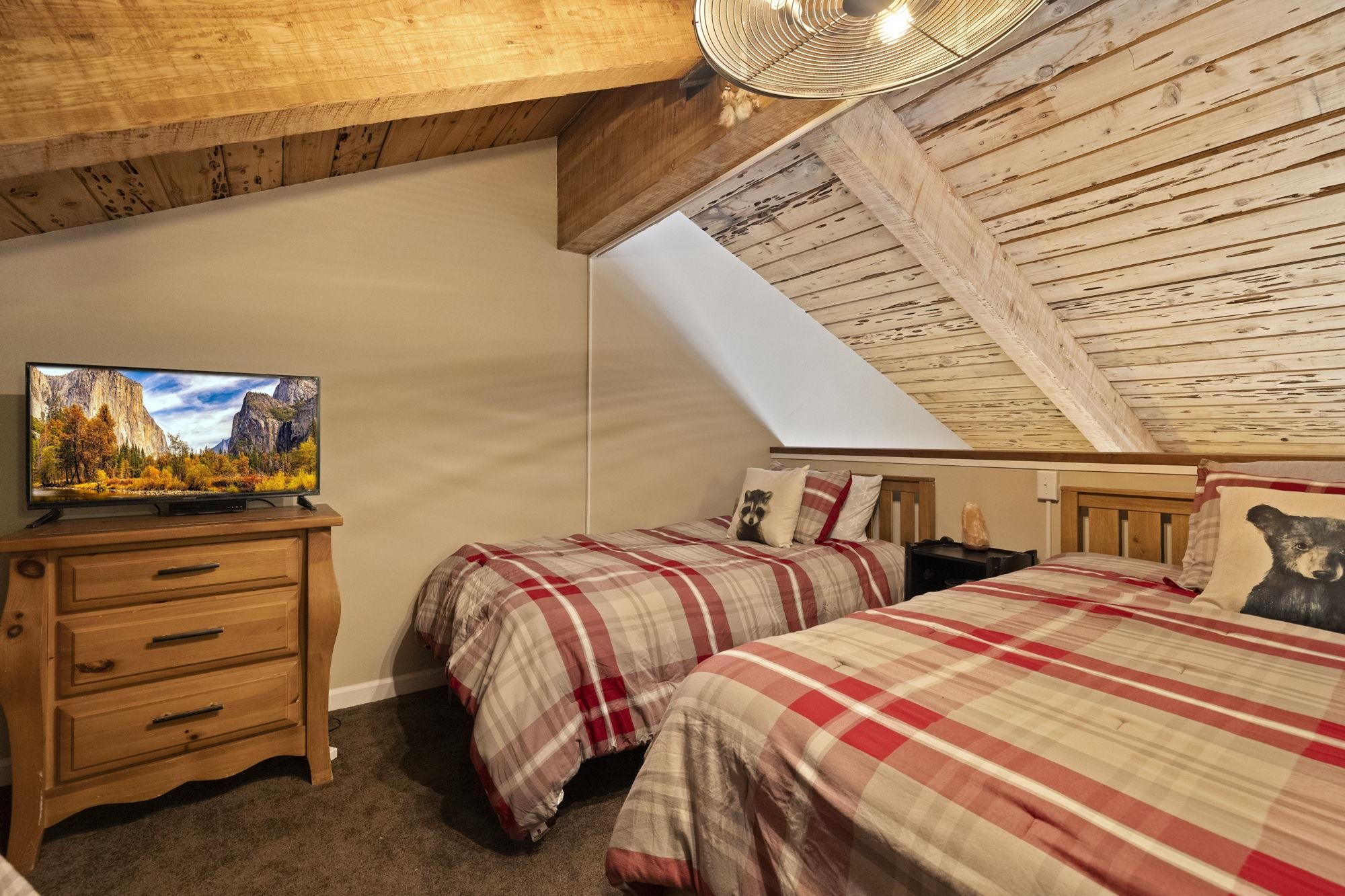 33757 Upper Leland Road, Unit B Pinecrest, CA 95364 - Photo 8 of 39 a bedroom with two beds and painting on the wall