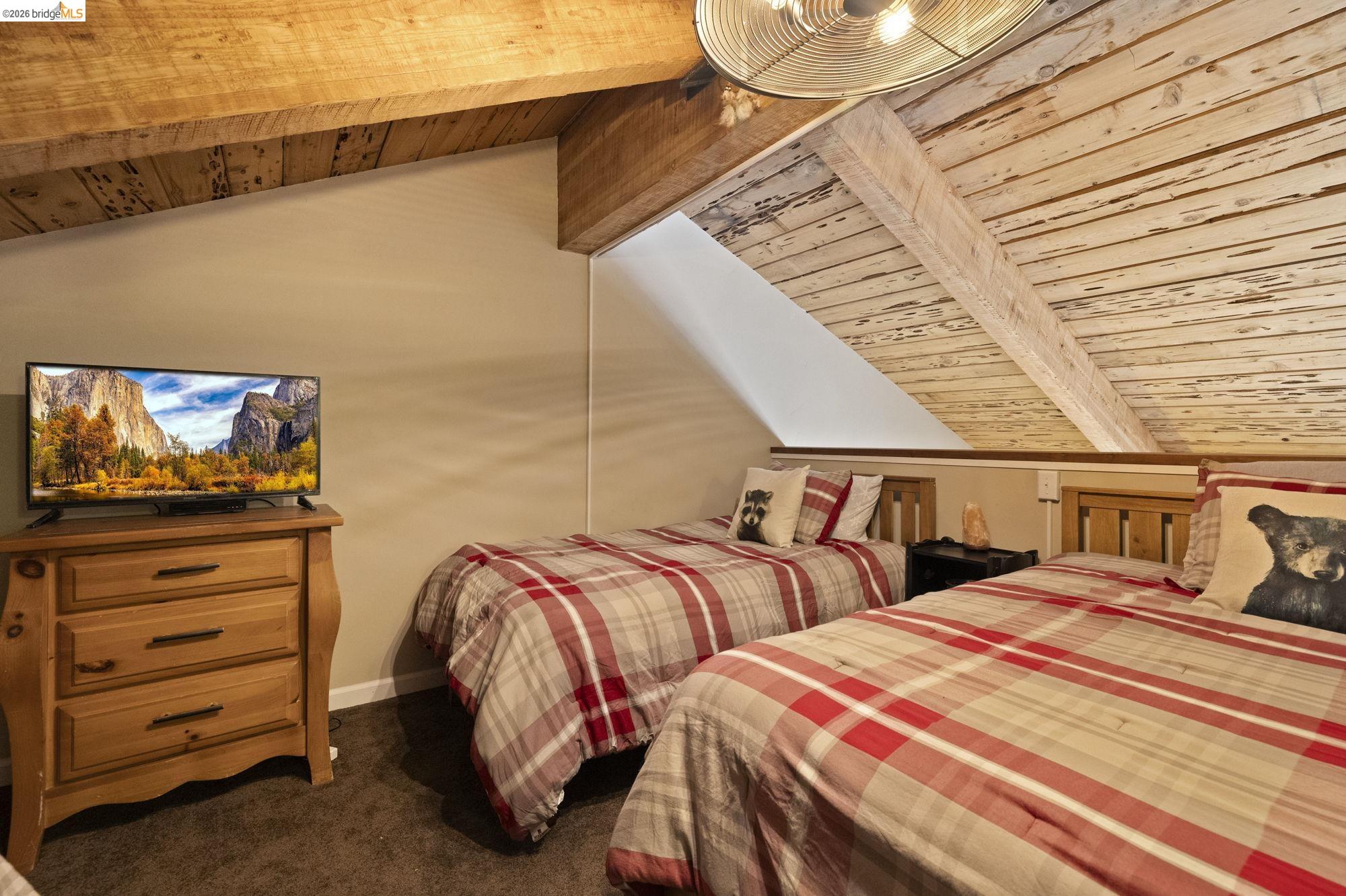 33757 Upper Leland Road, Unit B Pinecrest, CA 95364 - Photo 8 of 39 a bedroom with two beds and painting on the wall
