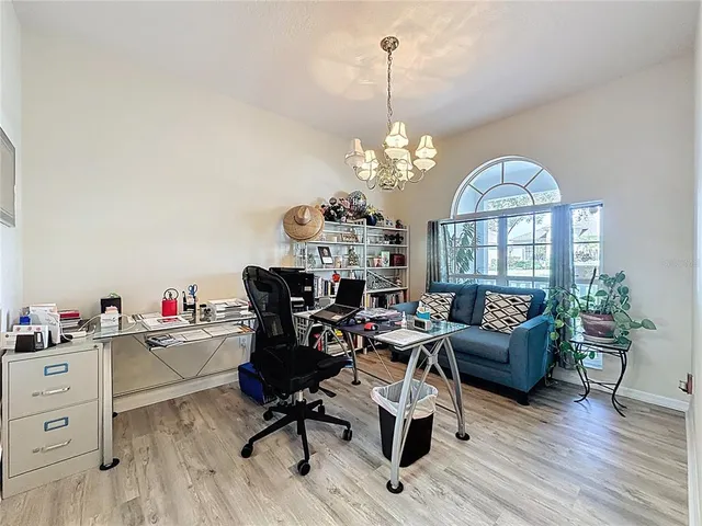 a view of a livingroom with furniture and a chandelier
