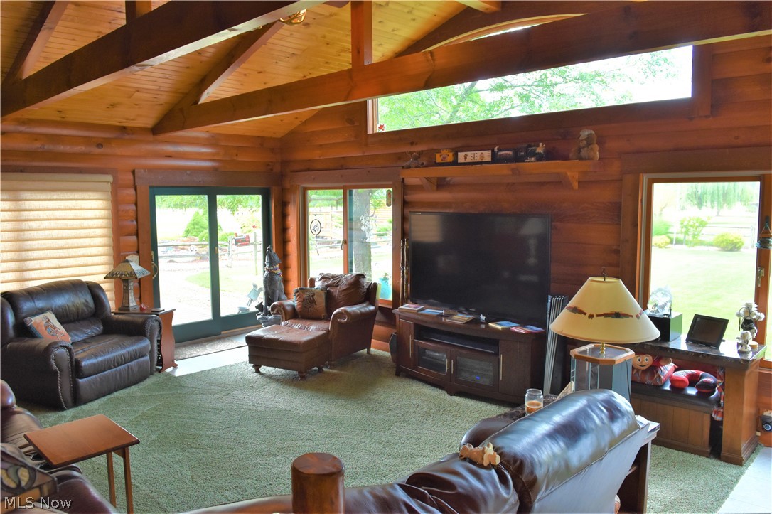 5908 Russia Road Amherst, OH 44001 - Photo 26 of 30 And the most amazing family room!!! Vaulted wood ceiling, beamed and stunning views!!