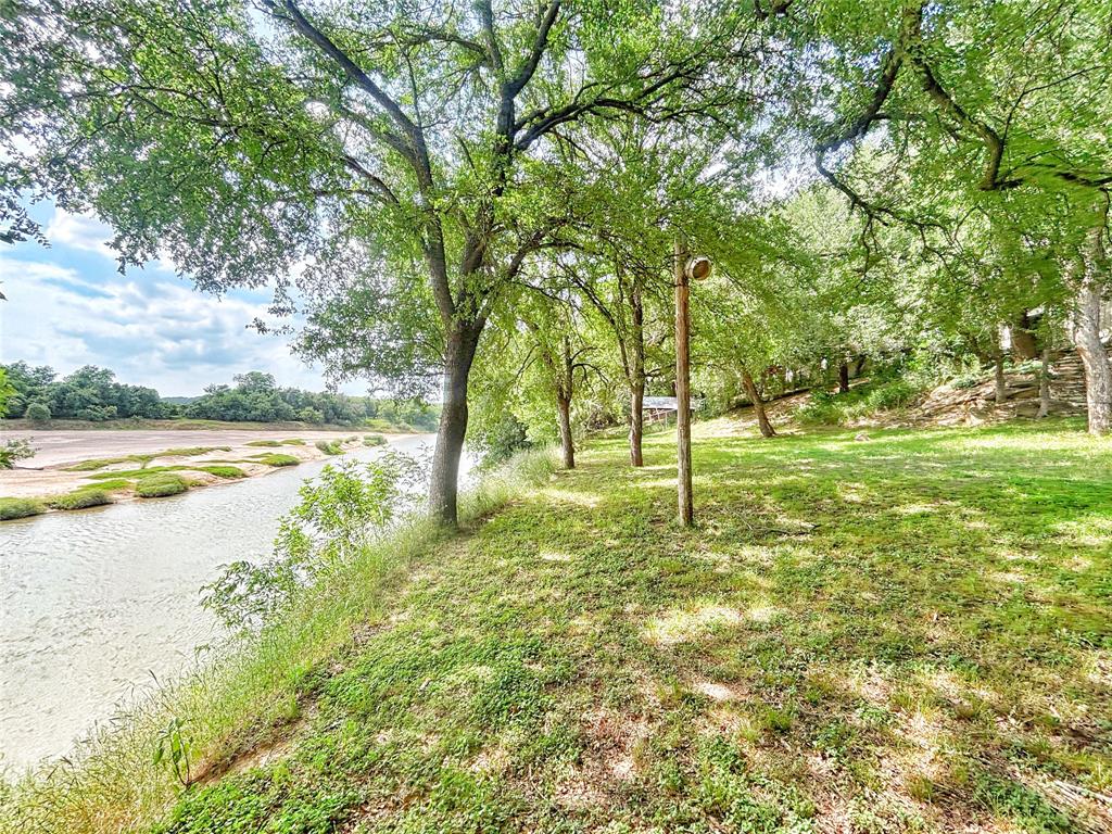 101 Riverview Road Millsap, TX 76066 - Photo 18 of 26 a view of a yard with swimming pool