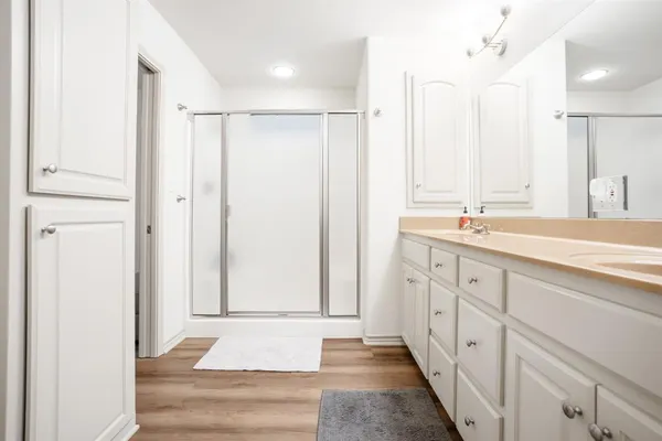 a bathroom with a double vanity sink and a mirror