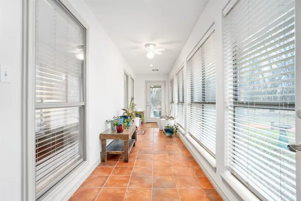 a lobby with furniture and large windows