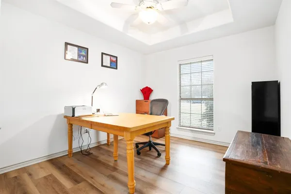 a workspace with furniture and window