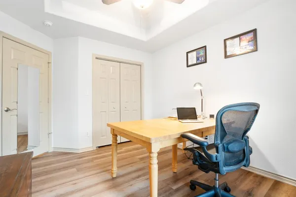 a workspace with furniture and wooden floor