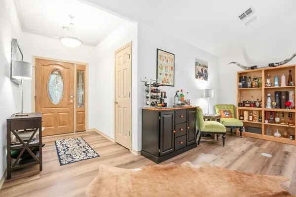 a view of workspace with window and lounge chair