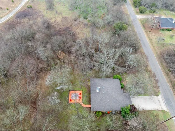 an aerial view of residential house with outdoor space