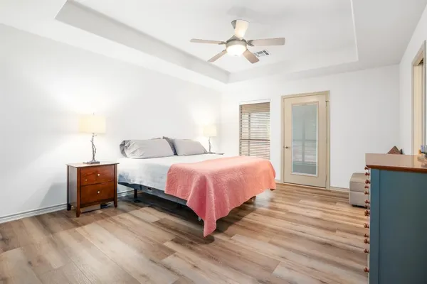 a bed room with a bed and a chandelier