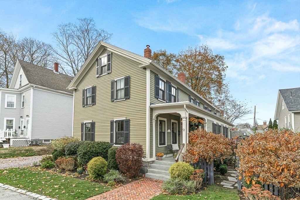 9 Chapman Avenue Andover, MA 01810 - Photo 34 of 39 a front view of a house with a yard and potted plants