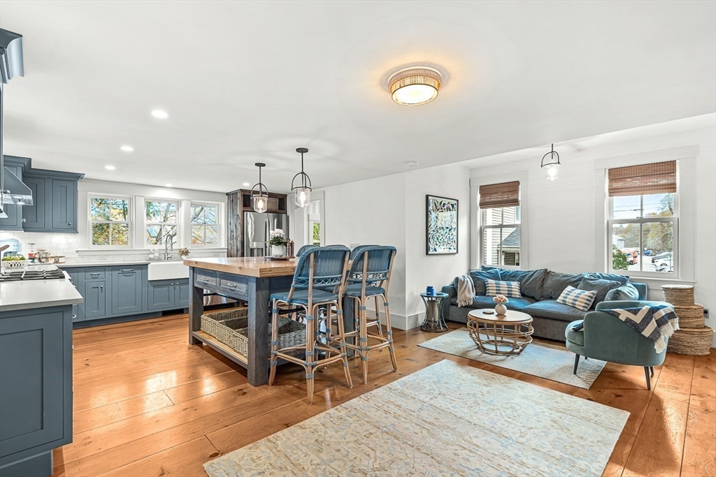 9 Chapman Avenue Andover, MA 01810 - Photo 10 of 39 a living room with furniture and a wooden floor