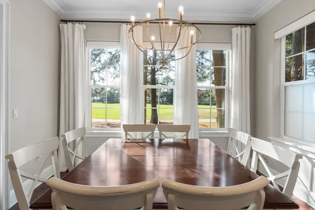 a kitchen with stainless steel appliances granite countertop a sink a stove and a wooden floors
