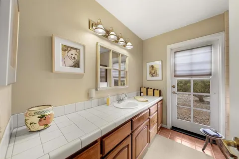 a bathroom with a sink double vanity and a shower
